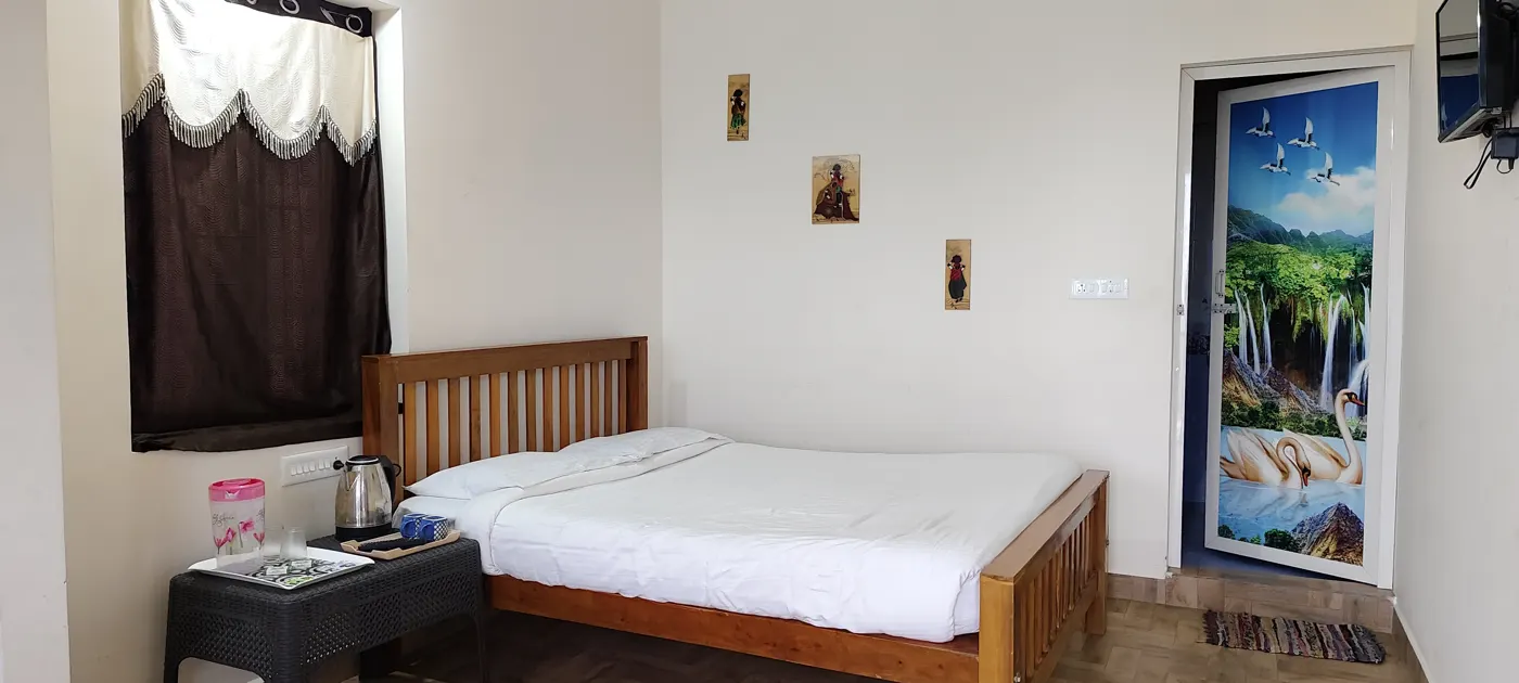 Timber-panelled bedroom at a Kodaikanal lodge